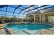 Relaxing screened pool and spa with access to the home's interior at 13616 Legends Walk Ter, Lakewood Ranch, FL 34202