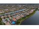 Aerial view of single-Gathering home near canal at 13925 Miranese St, Venice, FL 34293