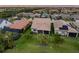 Aerial view of homes with solar panels and pools at 13925 Miranese St, Venice, FL 34293