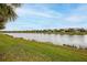 Community backs up to a lake and has lush landscaping at 13925 Miranese St, Venice, FL 34293