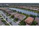 Aerial view of houses and community with a canal at 13925 Miranese St, Venice, FL 34293