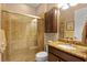 Bathroom with shower, granite vanity, and tile flooring at 13925 Miranese St, Venice, FL 34293