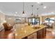 Kitchen island with granite countertop and stainless steel sink at 13925 Miranese St, Venice, FL 34293