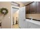 Convenient laundry room with washer, dryer, and extra storage at 13925 Miranese St, Venice, FL 34293