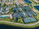 Aerial view of community tennis courts and pool at 13925 Miranese St, Venice, FL 34293