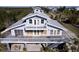 Elevated view of waterfront home showcasing large deck and private parking at 145 Burns Rd, Terra Ceia, FL 34250