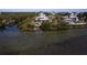 Aerial view of waterfront home with large deck and private dock at 145 Burns Rd, Terra Ceia, FL 34250