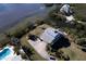 Elevated home on waterfront property with a pool at 145 Burns Rd, Terra Ceia, FL 34250