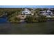 Aerial view of waterfront home with large deck and private dock at 145 Burns Rd, Terra Ceia, FL 34250