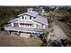 Elevated view of waterfront home showcasing large deck and private parking at 145 Burns Rd, Terra Ceia, FL 34250