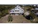 Waterfront home showcasing large deck and private dock, aerial view at 145 Burns Rd, Terra Ceia, FL 34250