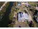 Bird's-eye view of house, showcasing waterfront location and private dock at 145 Burns Rd, Terra Ceia, FL 34250