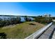 Grass backyard with water views from deck at 145 Burns Rd, Terra Ceia, FL 34250