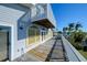 Wooden deck with railing overlooking the water at 145 Burns Rd, Terra Ceia, FL 34250