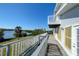 Spacious deck overlooking the water with white railing at 145 Burns Rd, Terra Ceia, FL 34250