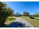 Long driveway leading to an elevated home at 145 Burns Rd, Terra Ceia, FL 34250