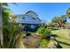 Two-story home with a pond in the front yard at 145 Burns Rd, Terra Ceia, FL 34250