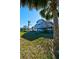 Elevated home nestled among palm trees at 145 Burns Rd, Terra Ceia, FL 34250