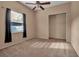 Bedroom with window, carpet, and closet at 14802 7Th E Ave, Bradenton, FL 34212