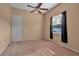 Light bedroom with carpet and ceiling fan at 14802 7Th E Ave, Bradenton, FL 34212