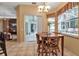 Breakfast nook with table and chairs, overlooking a bright, airy lanai at 14802 7Th E Ave, Bradenton, FL 34212