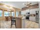 Modern kitchen with white cabinets, stainless steel appliances, and an island at 14802 7Th E Ave, Bradenton, FL 34212