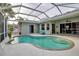 Inviting kidney-shaped pool with screened enclosure at 14802 7Th E Ave, Bradenton, FL 34212