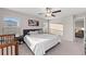 Bright bedroom with large bed, neutral decor, and ample natural light at 15304 Miller Creek Dr, Sun City Center, FL 33573