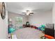 Bright bedroom with plush carpeting and ample space for toys at 15304 Miller Creek Dr, Sun City Center, FL 33573