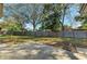 Large backyard with wooden fence and patio at 1625 Bravo Dr, Clearwater, FL 33764