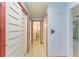 Bright hallway with light blue walls and terrazzo flooring at 1625 Bravo Dr, Clearwater, FL 33764