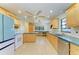 Kitchen with light wood cabinets and green countertops at 1625 Bravo Dr, Clearwater, FL 33764