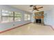 Living room with stone fireplace and tile flooring at 1625 Bravo Dr, Clearwater, FL 33764