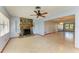 Living room with a stone fireplace and ceiling fan at 1625 Bravo Dr, Clearwater, FL 33764