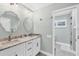 Elegant bathroom with double vanity and marble countertops at 1649 Manor Rd, Englewood, FL 34223