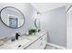 Clean bathroom with double vanity and marble countertop at 1649 Manor Rd, Englewood, FL 34223