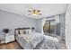 Guest bedroom with a queen-size bed and gray rug at 1649 Manor Rd, Englewood, FL 34223