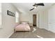 Cozy bedroom with a full-size bed and adjacent hallway at 16625 5Th E Ave, Bradenton, FL 34212