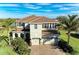 Two-story house with tile roof, large driveway, and landscaping at 16625 5Th E Ave, Bradenton, FL 34212