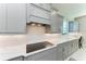 Modern kitchen with gray cabinets and quartz countertops at 16625 5Th E Ave, Bradenton, FL 34212