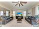 Bright living room featuring leather sofas and a large TV at 16625 5Th E Ave, Bradenton, FL 34212