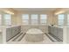 Luxurious bathroom with double vanity and soaking tub at 16625 5Th E Ave, Bradenton, FL 34212