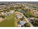 Aerial view of a home on a waterfront lot within a residential community at 170 Bonita Dr, Rotonda West, FL 33947