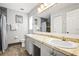 Bathroom with double vanity and tiled floors at 170 Bonita Dr, Rotonda West, FL 33947