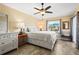 Main bedroom with a queen-size bed and lots of natural light at 170 Bonita Dr, Rotonda West, FL 33947