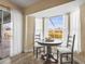 Cozy kitchen nook with a round table and view of the pool at 170 Bonita Dr, Rotonda West, FL 33947