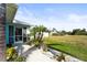 Landscaped walkway leading to the home's entrance at 170 Bonita Dr, Rotonda West, FL 33947