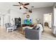 Bright living room featuring gray sofas and a flat-screen TV at 170 Bonita Dr, Rotonda West, FL 33947