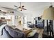 Open living room with gray sofas, coffee table and view of kitchen at 170 Bonita Dr, Rotonda West, FL 33947