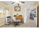 Home office with a desk, chair, and view of living room at 170 Bonita Dr, Rotonda West, FL 33947